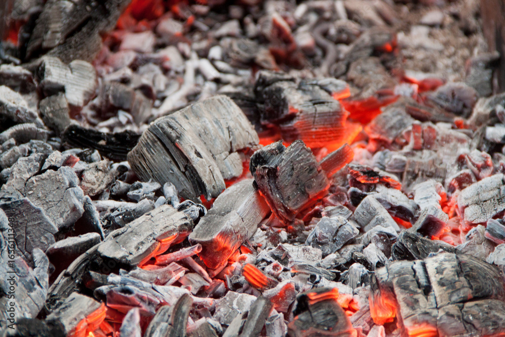 Photo of hot coals. texture of coals on the grill. Edge in the grill Photo of hot coals. texture of coals on the grill. Edge in the grill