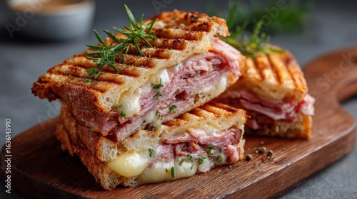 The Cuban Sandwich is a classic Cuban-American grilled sandwich made with roast pork, ham, Swiss cheese, mustard, and pickles pressed between crispy Cuban bread.