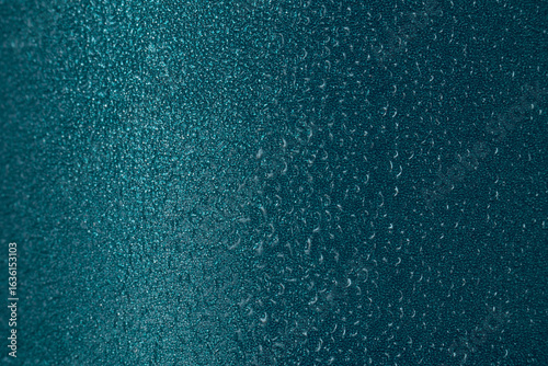 water dew drops on metal painted surface macro background