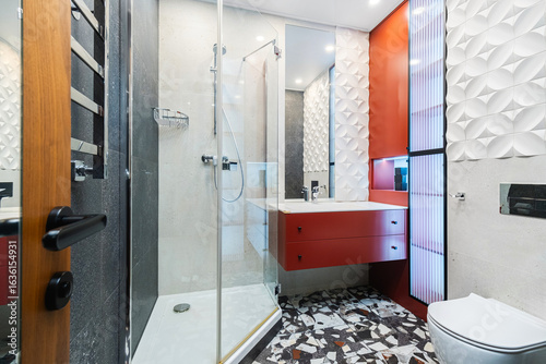 Stylish modern bathroom featuring sleek design elements and vibrant colors in a residential setting
