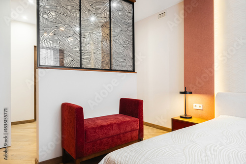 Modern bedroom design featuring minimalist decor and stylish furnishings in a cozy accommodation space