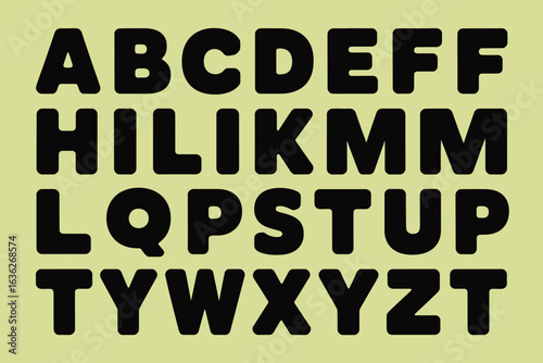 A display of the alphabet with letters in black rounded font on a light yellow background arranged in rows