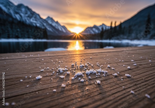 Snowy dock sunrise mountain lake winter