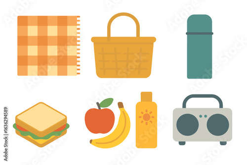 Picnic essentials displayed on a blanket including food items and accessories for outdoor fun