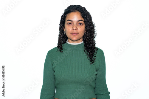 Cuadro en lienzo Studio Passport-Style Portrait of Serious Latina Woman on White Background