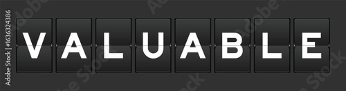 Black color analog flip board with word valuable on gray background
