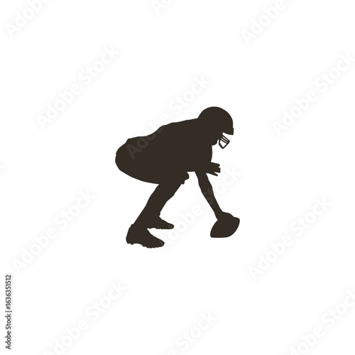 Football player silhouette ready to snap the ball for the big game