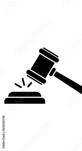 Legal proceedings and courtroom gavel striking a sounding block