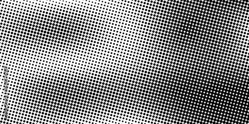 Aged halftone gradient background. Faded dotted grit noise texture. Black and white rasterized sand wallpaper. Retro pixelated backdrop. Anime or manga style comic grain overlay. Vector grunge bitmap