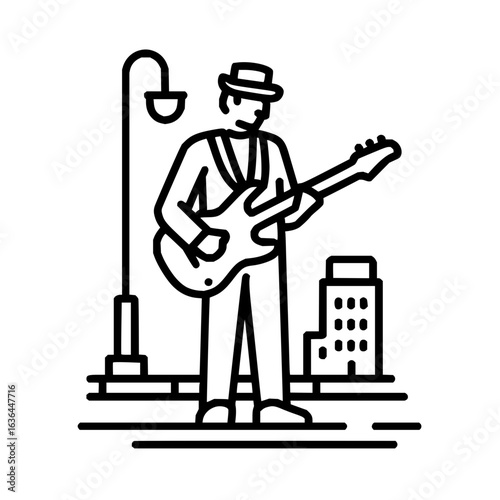 Street musician playing guitar in the city under a lamppost with a building nearby
