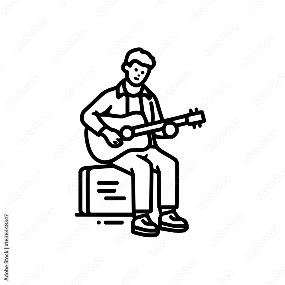 Acoustic guitar player sitting on a box while playing music with great concentration and passion Acoustic guitar player sitting on a box while playing music with great concentration and passion