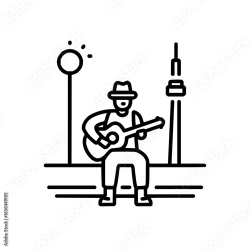 Street musician playing guitar near the tower and the street lamp in the city park area