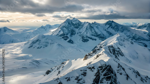 Majestic snow covered mountain range under dramatic cloudy sky full hd 4k stock image download winter