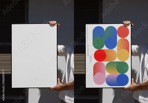 Mockup Of Man Holding Vertical Customizable Framed Poster