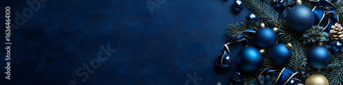 Dark blue Christmas background with decorations and copy space