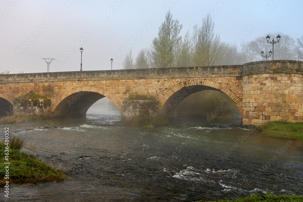 Fototapeta premium Romanesque bridge over the Pisuerga River in Aguilar de Campoo