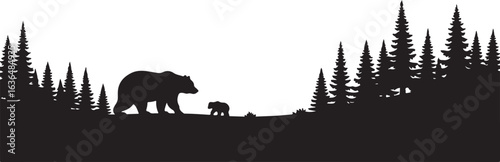 Silhouette of a mother bear and cub walking through a pine forest family