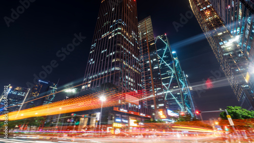 Fototapeta Naklejka Na Ścianę i Meble -  Night view of modern city skyscrapers with light trails