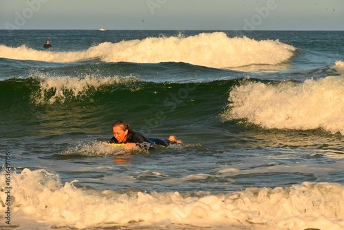 Photography Bodyboarding, woman surfing with a bodyboard, Atlantic coast, waves
