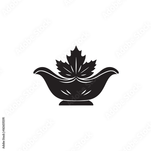 Elegant black silhouette of a gravy boat with a decorative leaf emblem on a white background