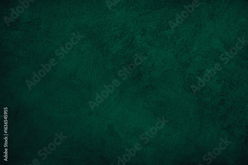 Black dark green blue emerald teal viridian texture background. Painted concrete wall surface. Grunge rough uneven plaster scratched damaged. Close-up. Design. Template. Blank.