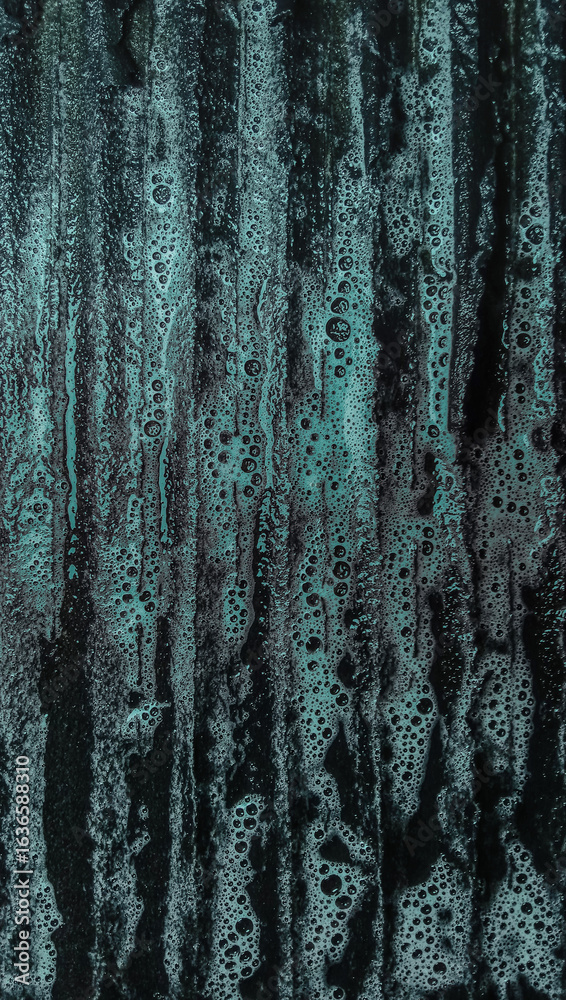 Fototapeta premium Cyan-colored laundry detergent on a laundry board, close-up shot, abstract background