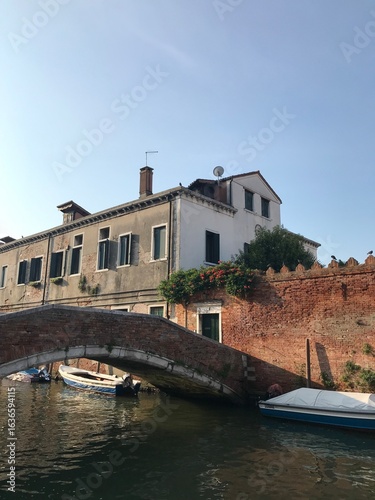 Close-up of weathered Venetian architecture on the water.
