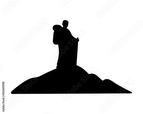 Silhouette of a figure carrying a sack up a hill in darkness