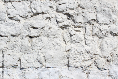 Stone white wall, unusual texture.