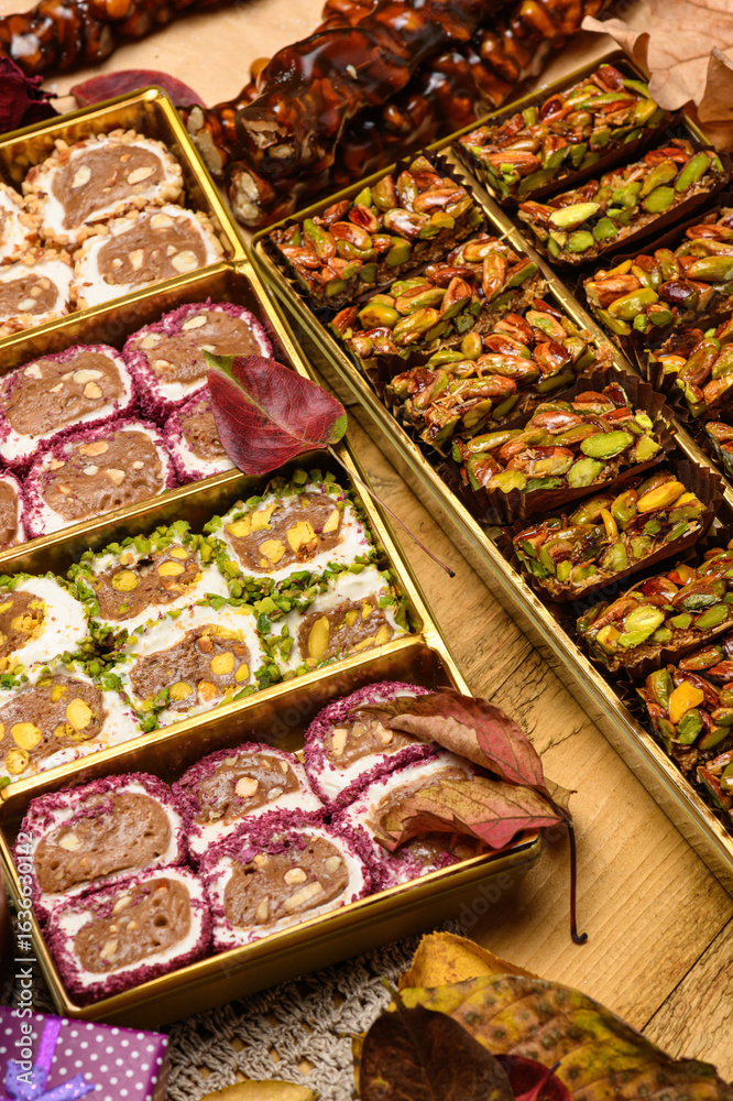 Fototapeta premium Sweet food Turkish delight on wooden background, assorted locum and candy for decorated backdrop