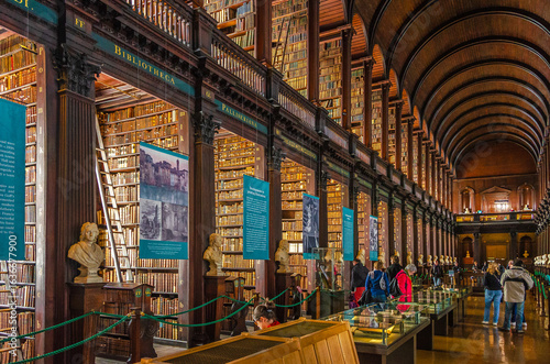 Tableau sur toile Visitors Explore the Historic Trinity College Library in Dublin, Ireland