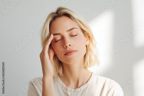 Calm expression conveys inner peace, soft light enhances emotion