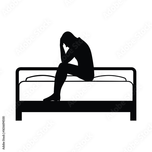 Man sitting on bed in despair silhouette