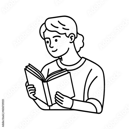 A handsome student sits studying a book in a library