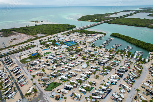 Aerial view of RVs nestled in the sun-kissed Big Pine Key, the Overseas Highway stretching across turquoise waters, a tropical haven, Big Pine Key, Florida, United States.