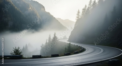 A Serpentine Mountain Road Disappearing into Ethereal Morning Valley Fog