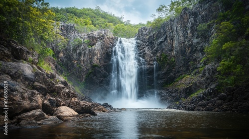 Majestic waterfall cascading down rocky cliffs.