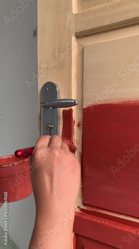 painting a wooden door with candy brown color paint.