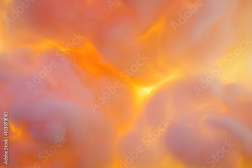 Abstract background of swirling pink and orange smoke clouds with a warm, glowing yellow light source creating an ethereal and dreamy effect.