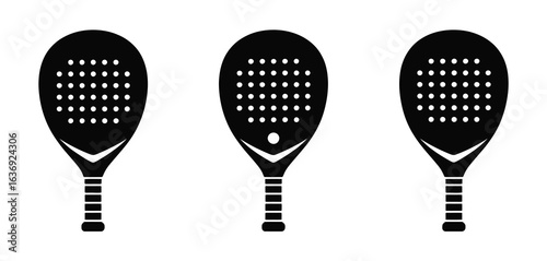 Three black padel tennis rackets with white dots arranged in a row