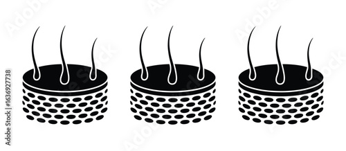 Three black pincushions with needles sticking out in a row