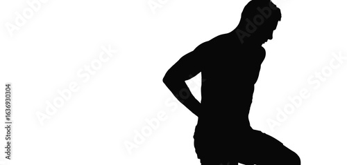 Silhouette of a man with his hand on his lower back in pain