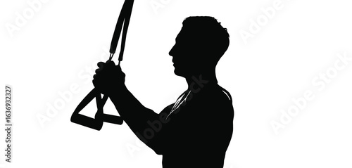Silhouette of a man holding suspension training straps for a workout