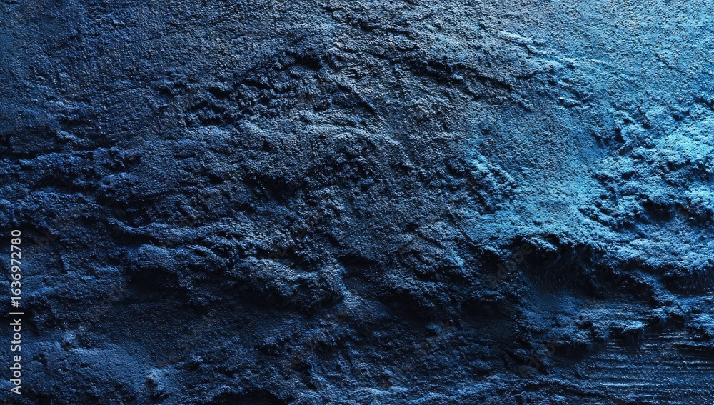 Obraz premium Textured deep blue wall, rough surface, dramatic lighting
