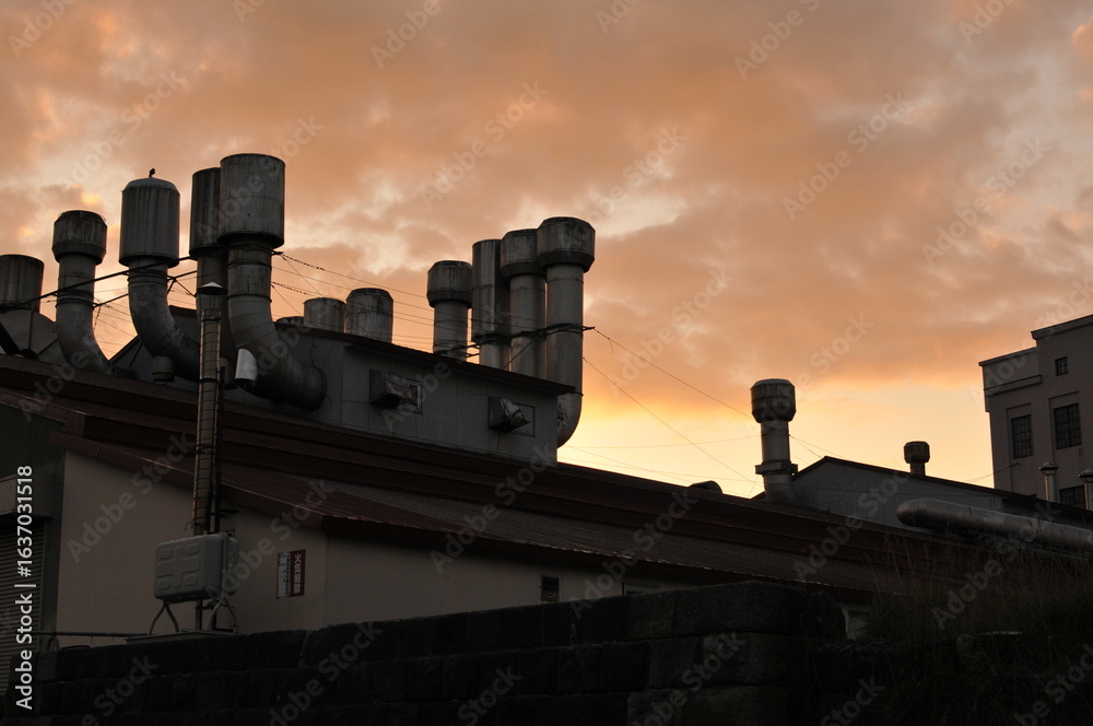 Factory chimney and sunset Factory chimney and sunset