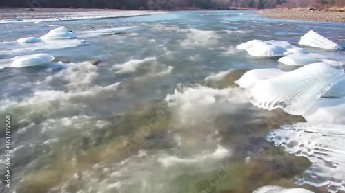 Icy River Rapids Flowing Through Winter Landscape Scenery