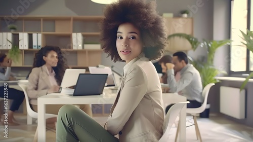 A young professional woman with curly hair dressed elegant suit
