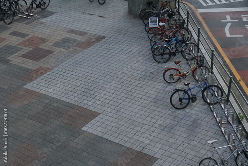 bicycles parking on empty pavement