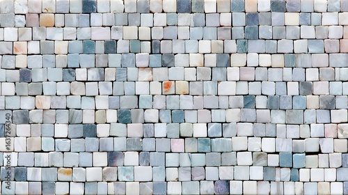 Close-up view of a patterned mosaic tile wall.