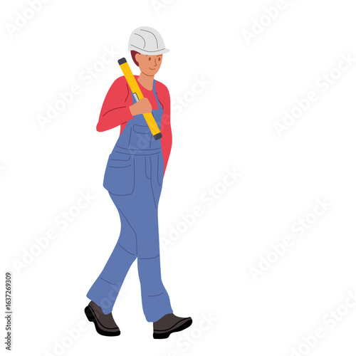 Worker in blue overalls carrying a pencil while walking in a construction setting